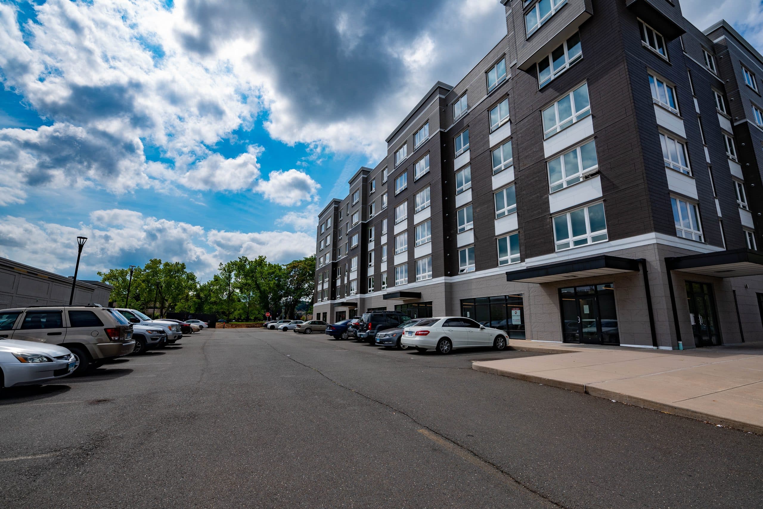 Columbus Commons seen along the street, its ground-floor commercial frontage running the length of the block