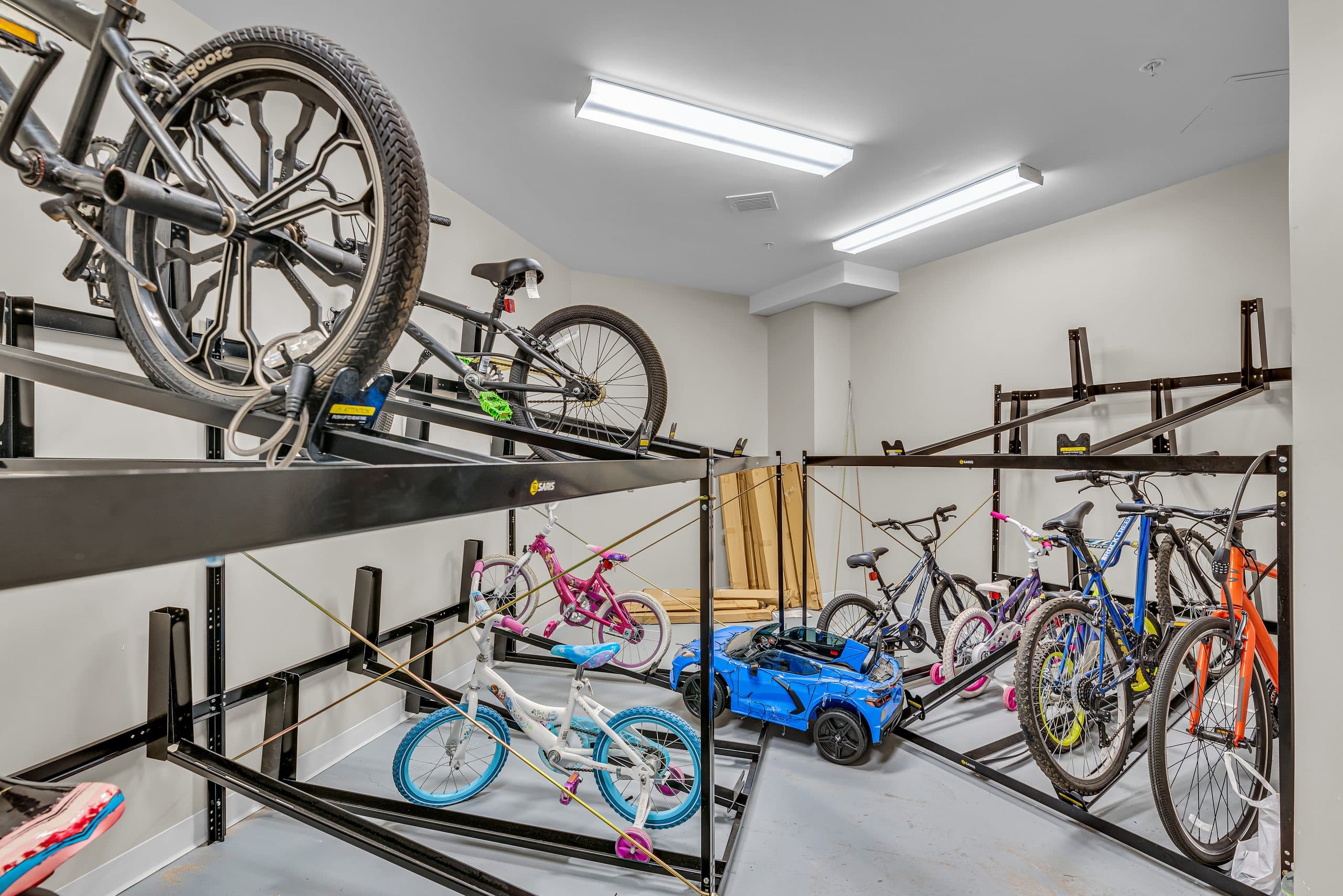 The secure bike storage room, with two-tier racks holding residents' bikes